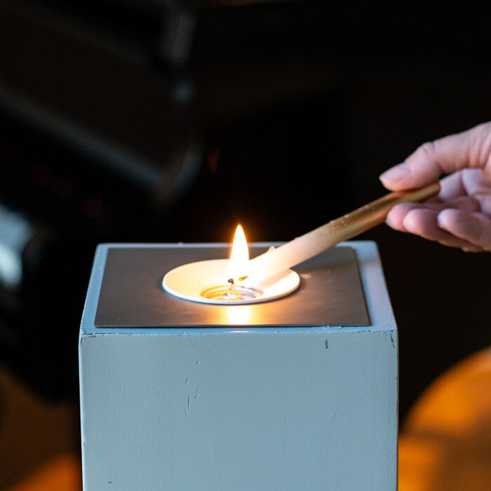 Een kaarsje in een windlicht